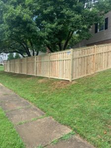 wood fence on grassy slope